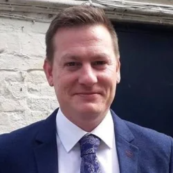 Person frustrated with no website traffic discovering a simple traffic solution online.